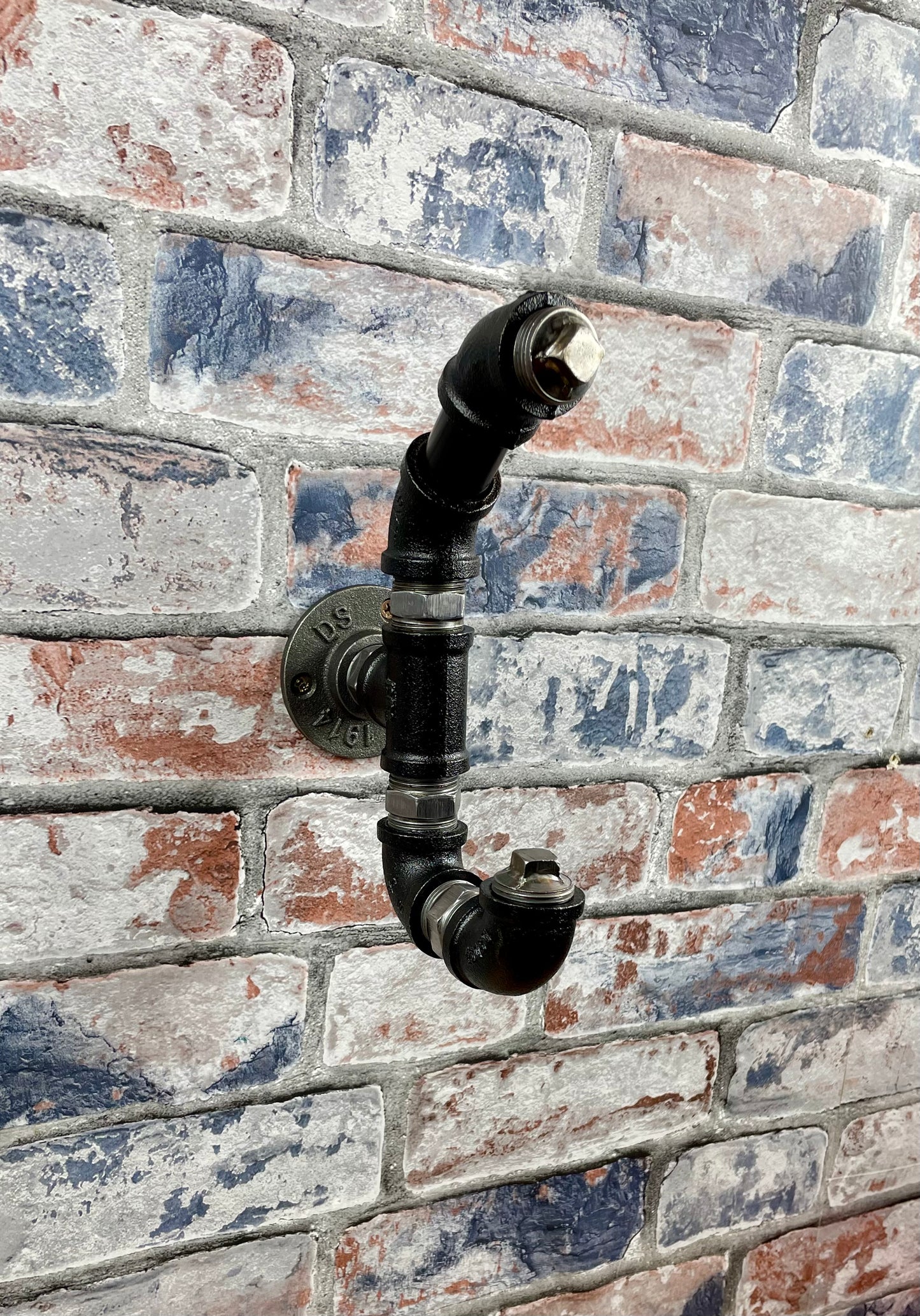 Industrial Style Metal Pipework Coat Hooks.
Chunky and super sturdy, these metal coat hooks come fully built and ready to attach to your wall.