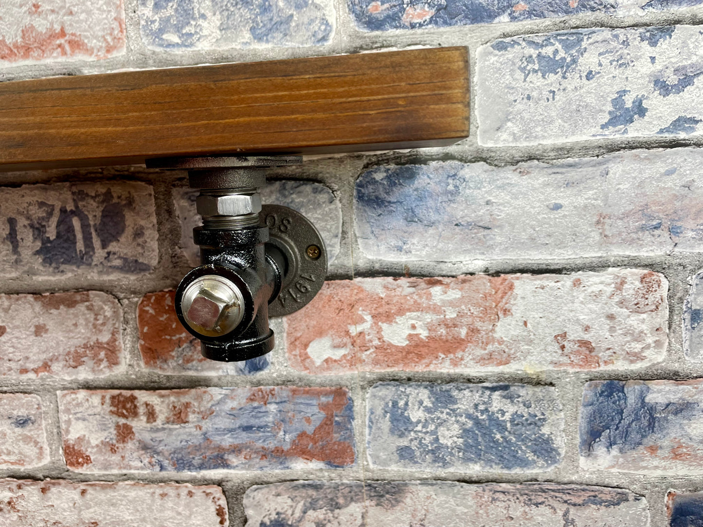 20cm x 10cm handmade industrial style shelf with metal pipework brackets.
Made from solid wood and metal industrial style pipework, this unit is perfect for industrial or loft living style home decor and suitable to use anywhere around the home.