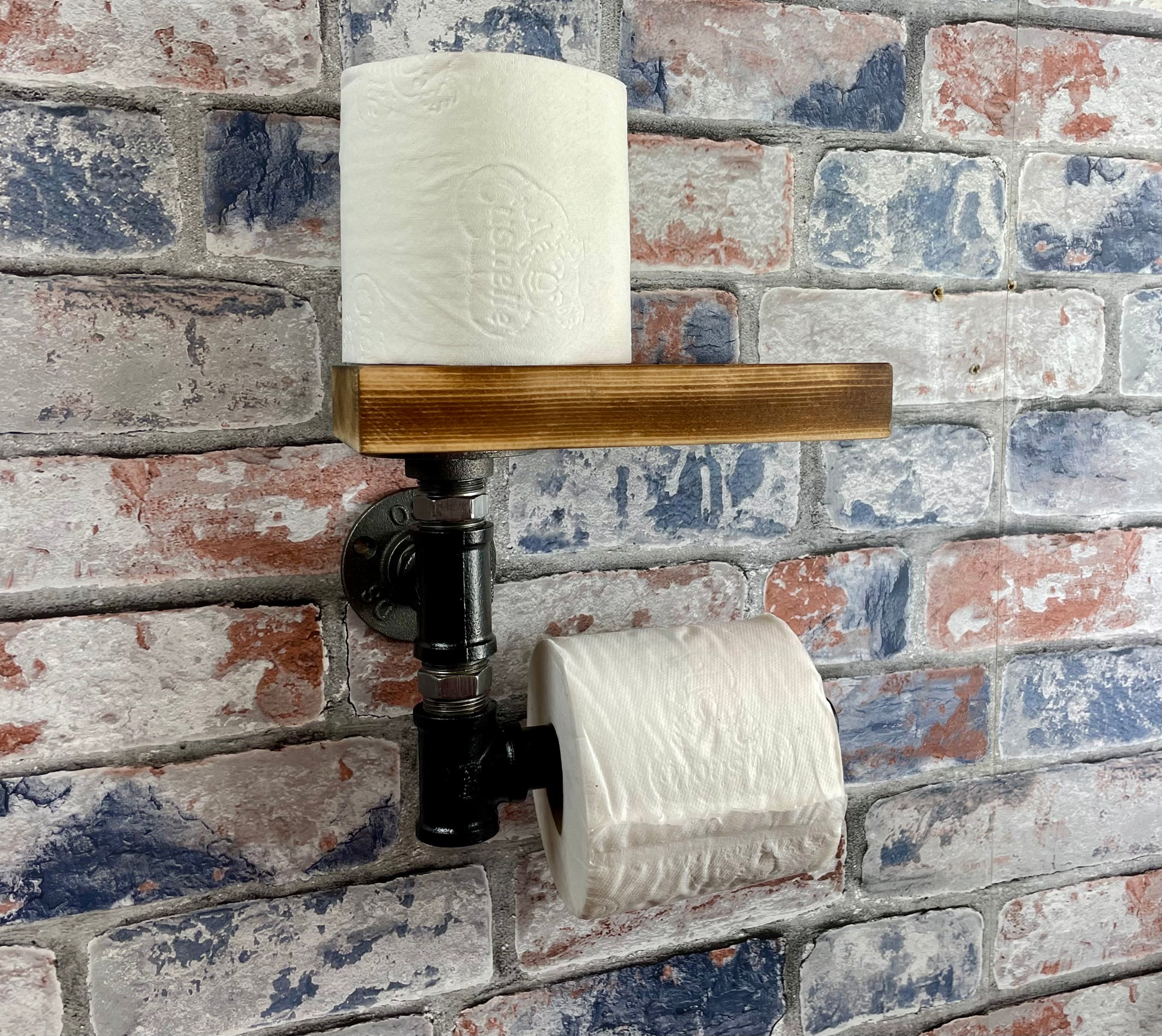 Industrial Style Pipework Toilet Roll Holder.

Made to order industrial style pipework toilet roll holder with solid wood shelf in a choice of colours.