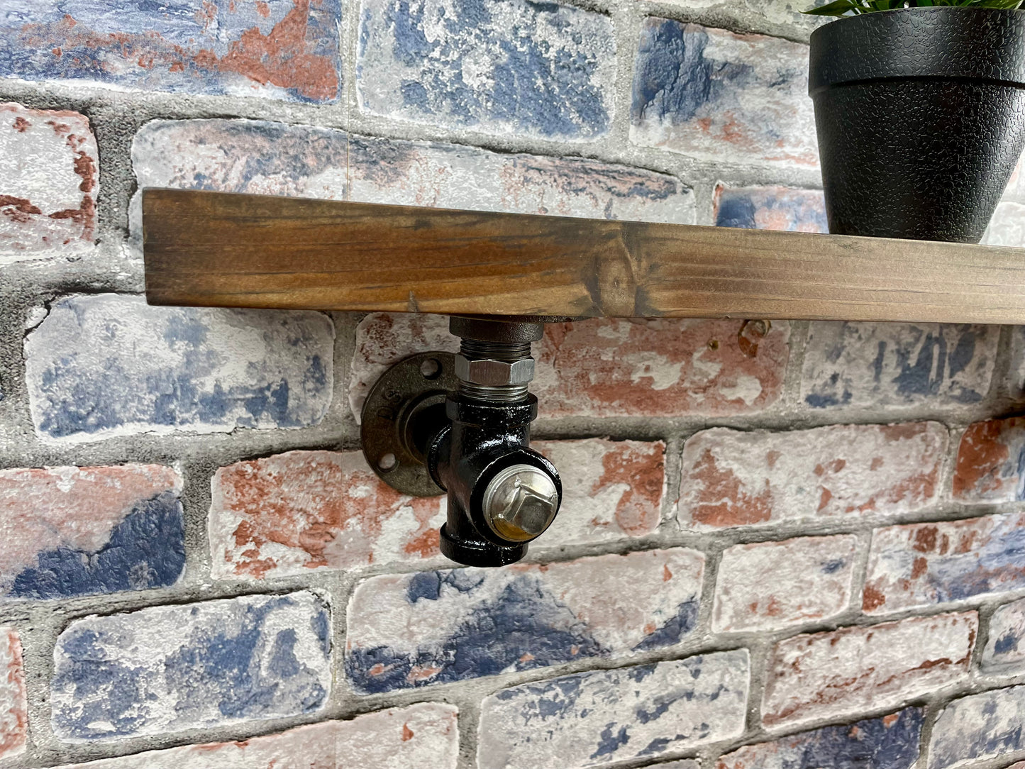20cm x 10cm handmade industrial style shelf with metal pipework brackets.

Made from solid wood and metal industrial style pipework, this unit is perfect for industrial or loft living style home decor and suitable to use anywhere around the home.